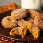 Pumpkin Spice Mini Donuts piled on a plate.