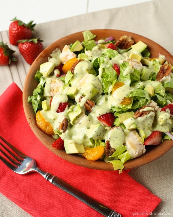 Chicken Strawberry Salad with Avocado Poppy Seed Dressing on a plate wit forks.