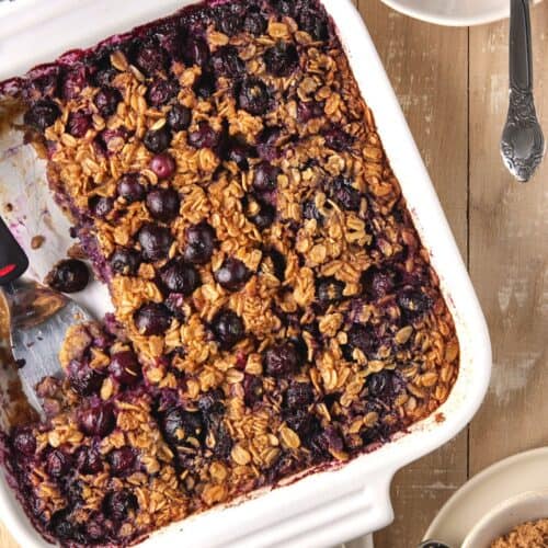 Blueberry baked oatmeal with square cut out.
