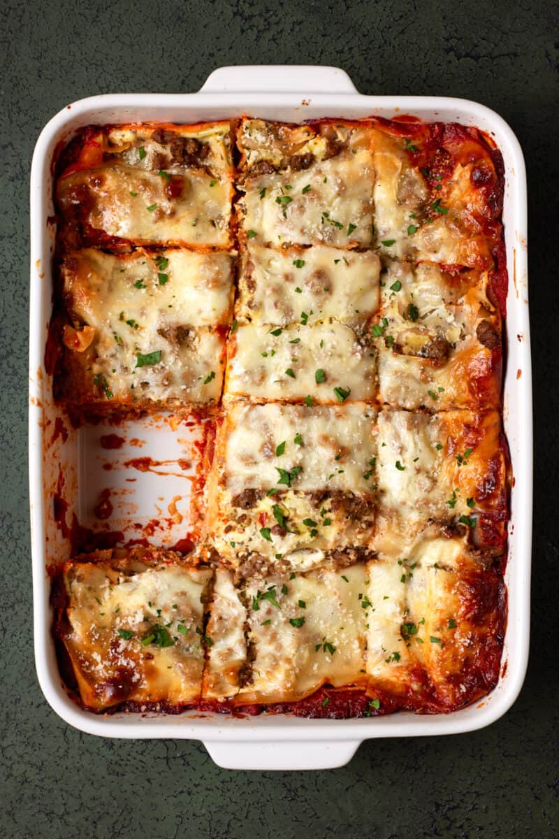 Baked No Boil Lasagna in white pan.