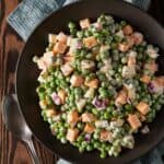 Pea & Cheese salad in a dark bowl.