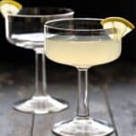 Pear Martinis in glasses with lemon garnish.