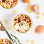 Baked eggs in ramekins, with cheese.