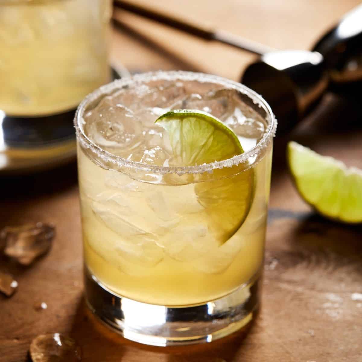 margarita on the rocks with salt with lime wedge.