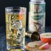 Elderflower Hard Cider Cocktails need only two ingredients. Cider and elderflower stirred together in an ice-filled glass and garnished with apple slices.