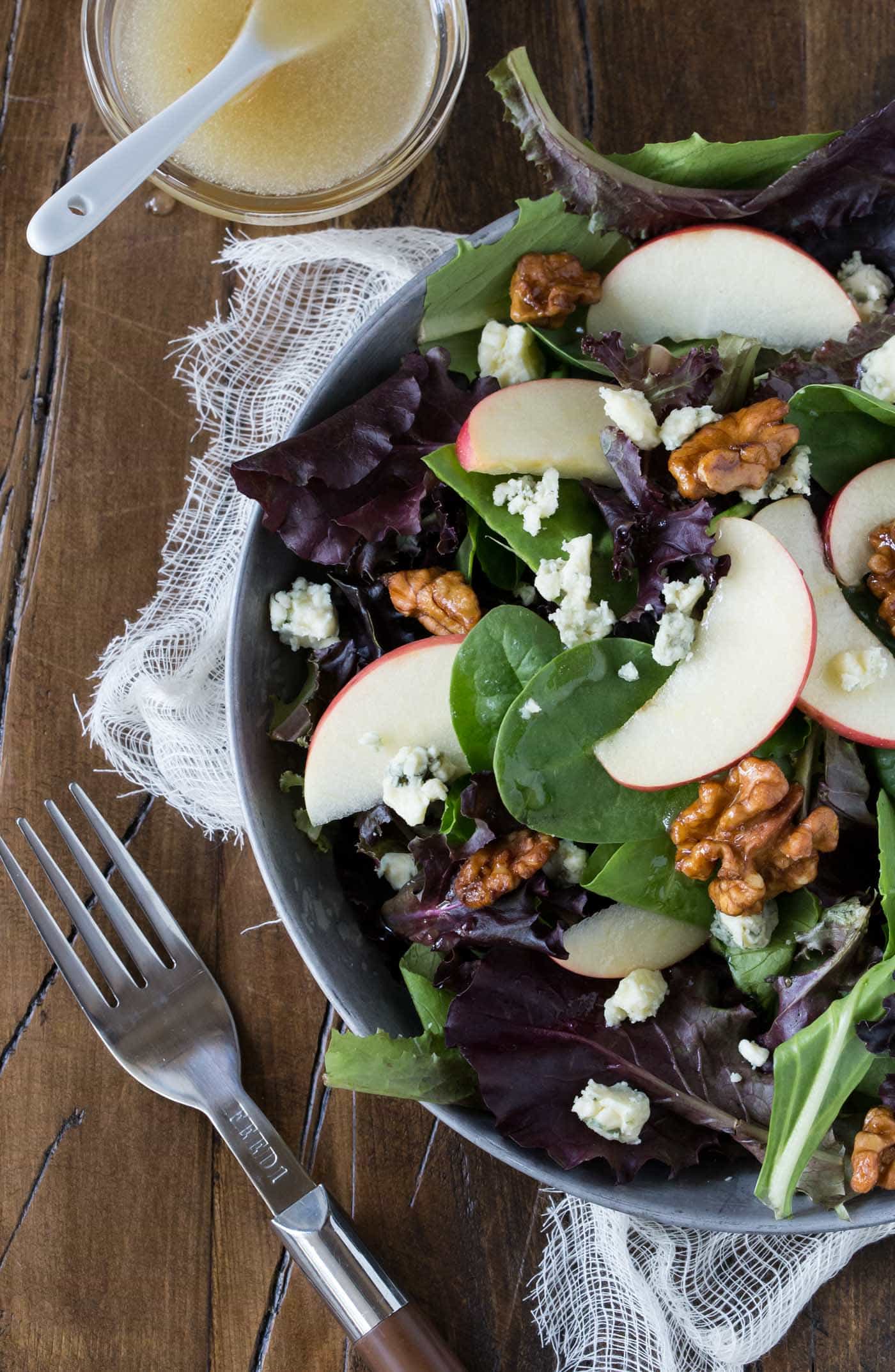 A plate of salad with fork.