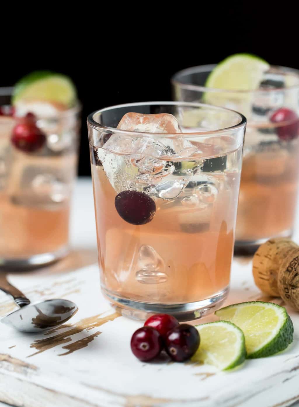 Sparkling Cranberry Gin Christmas Cocktails - Garnish with Lemon
