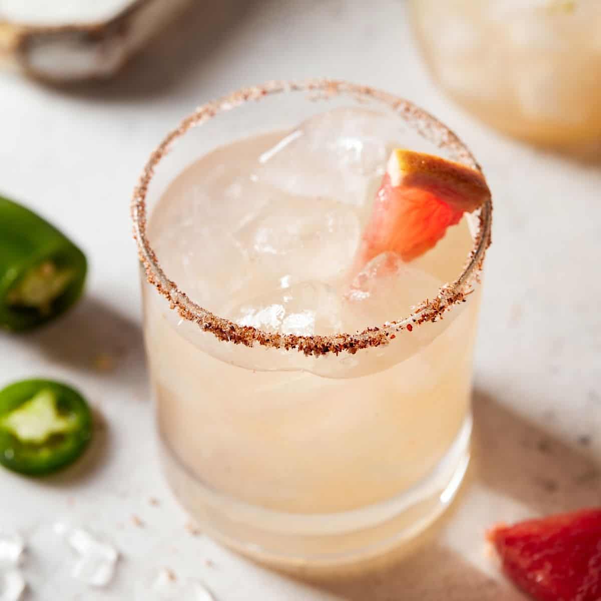 Grapefruit Margarita in a chili rimmed lowball glass.