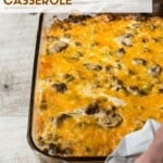 Two hands holding a 9 x 13 casserole dish of Breakfast Casserole.