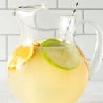 Pitcher of sangria with stir spoon.