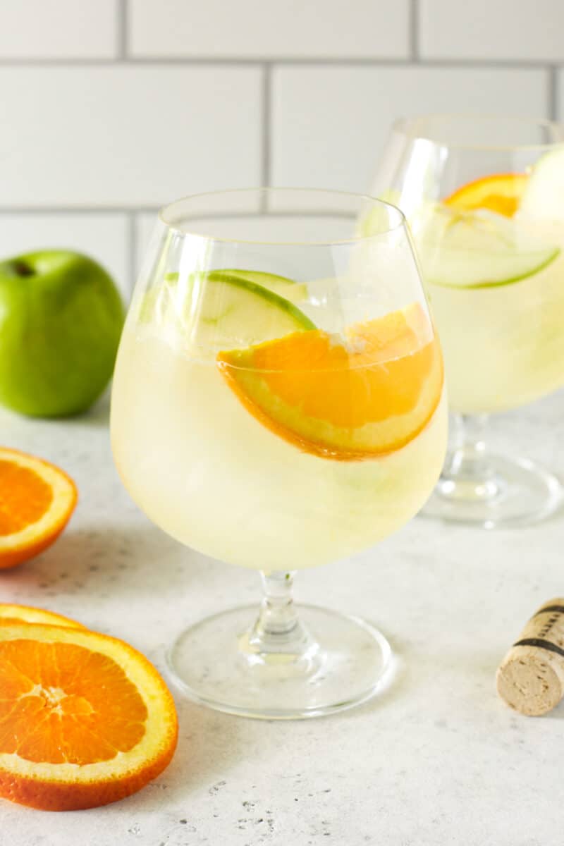 glass of lemonade with fresh fruit and ice.