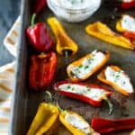 stuffed mini peppers on a sheet pan.