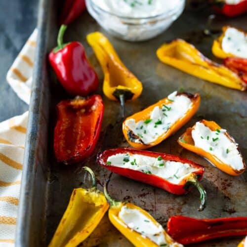 stuffed mini peppers on a sheet pan.