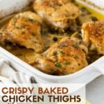 Chicken thighs with parsley and capers in white baking dish.