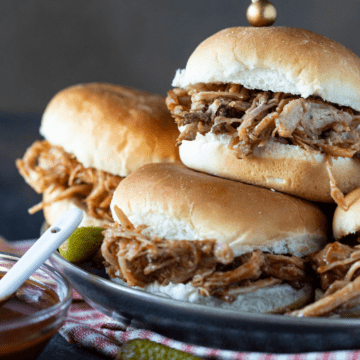 pulled pork sandwiches on plate.