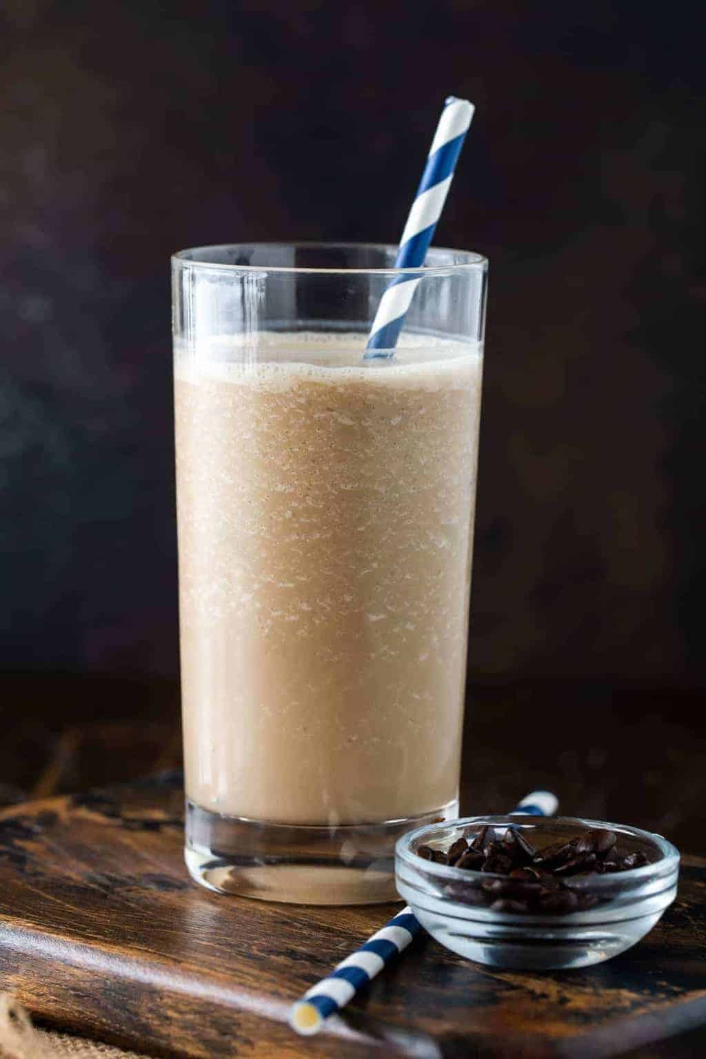  Coffee Smoothie in a high ball glass on a dark background.