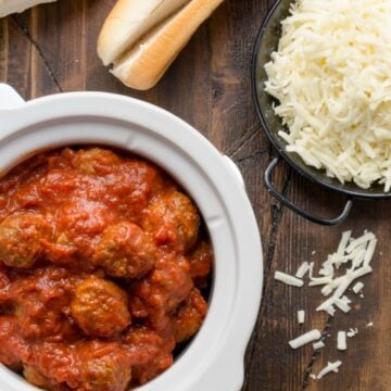 meatballs in slow cooker with cheese.