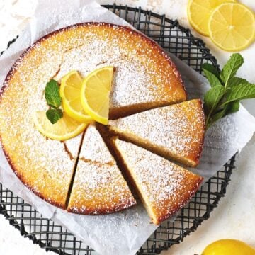 Slices of lemon ricotta cake on a cooling rack.