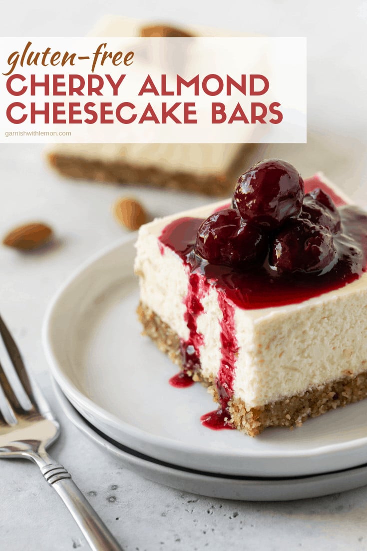 Small white plate filled with a slice of Gluten-Free Cherry Almond Cheesecake Bars.