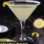 Pinterest image of Lemon Drop martini recipe in a single glass with lemon wedges for garnish.