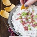 Frito dipping into chipped beef dip.