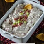¾ angle of chipped beef dip in white dish.