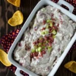 Coked Chipped Beef Dip in a white dish with corn chips.