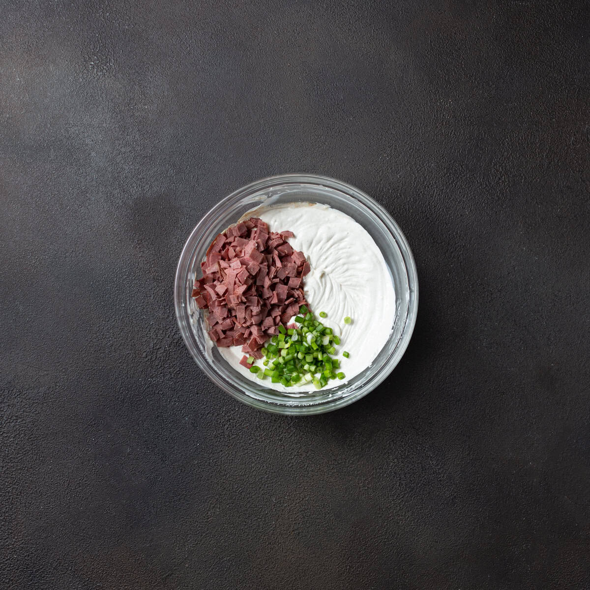 Diced beef and green onion on top of cream cheese mixture.