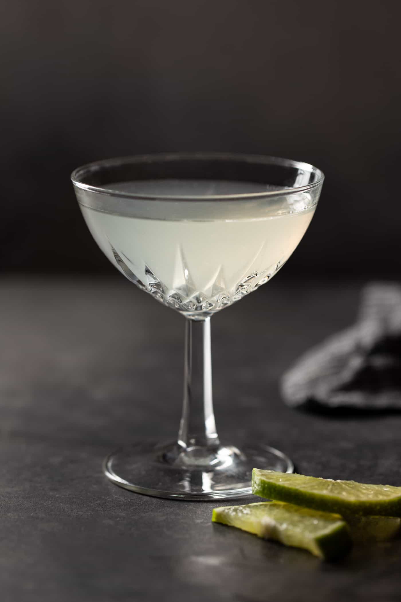 A single coupe glass filled with Elderflower Gin Gimlet. 