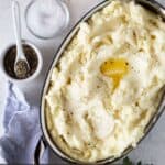 mashed potatoes in silver oval gratin dish.