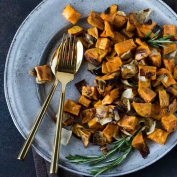 roasted sweet potatoes and onions on plate.