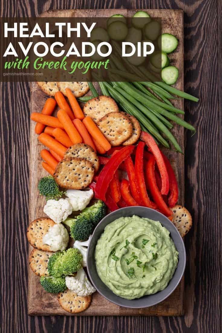 A bunch of different types of vegetables on a tray, with Avocado dip.