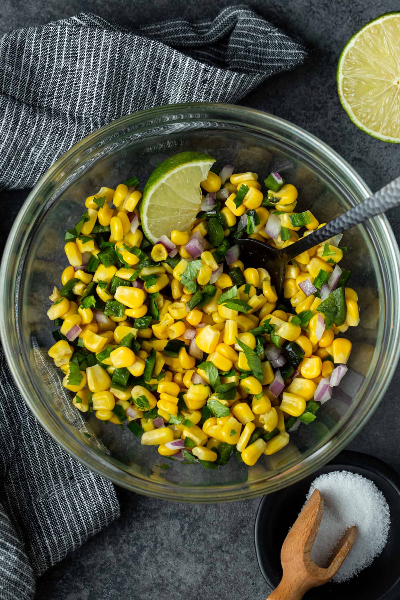 Glass bowl filled with Roasted Chili Corn Salsa recipe