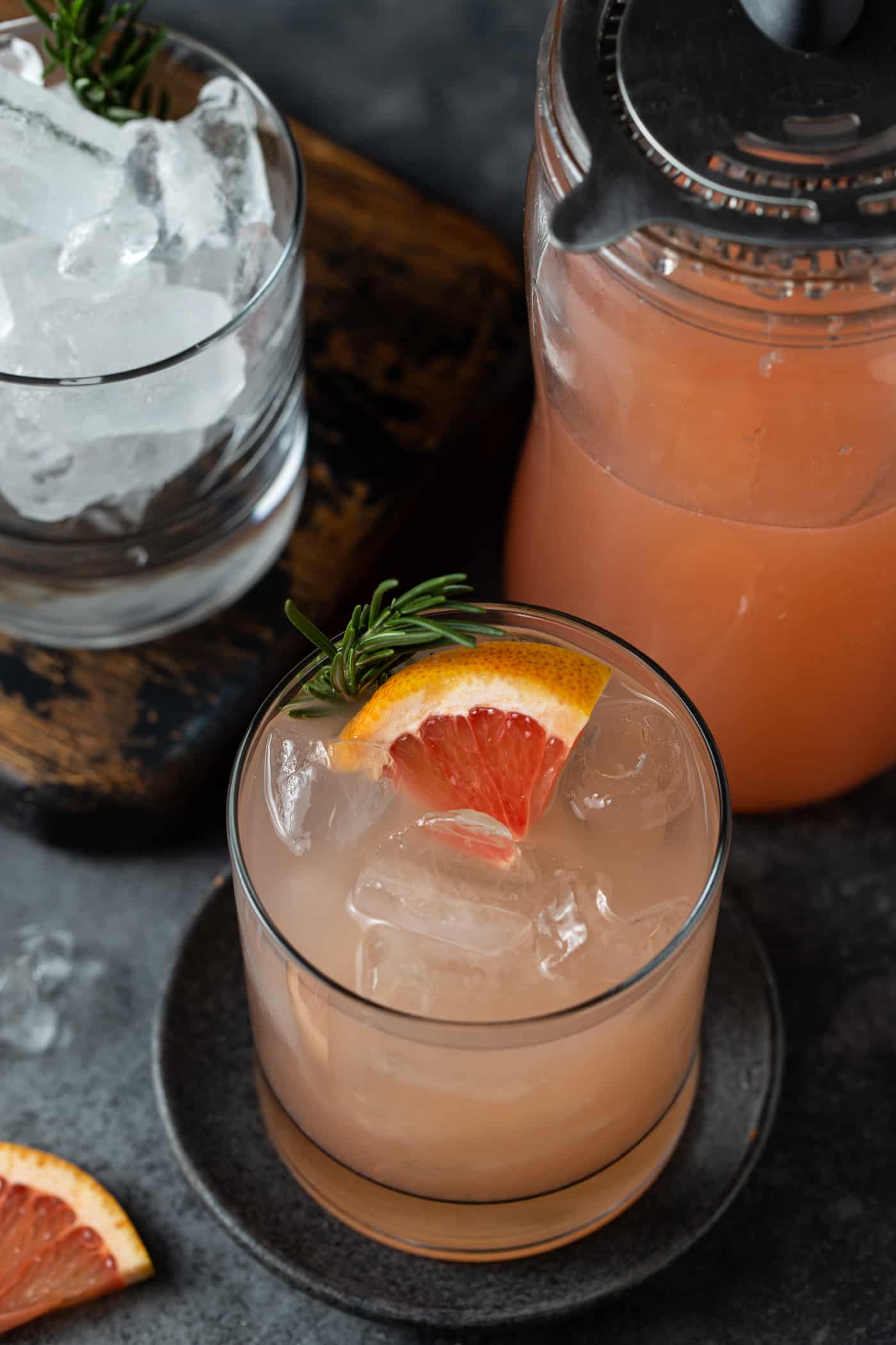 A close up of a glass of greyhound on a table, with Grapefruit juice.