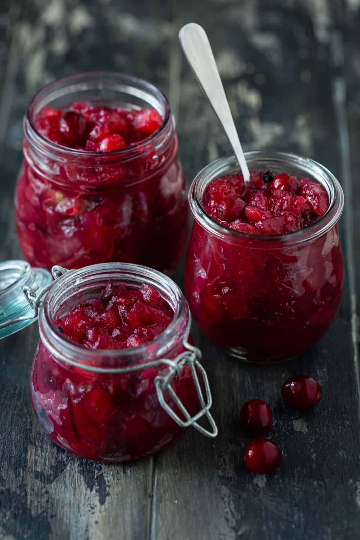 3 glass jars of apple and cranberry chutney