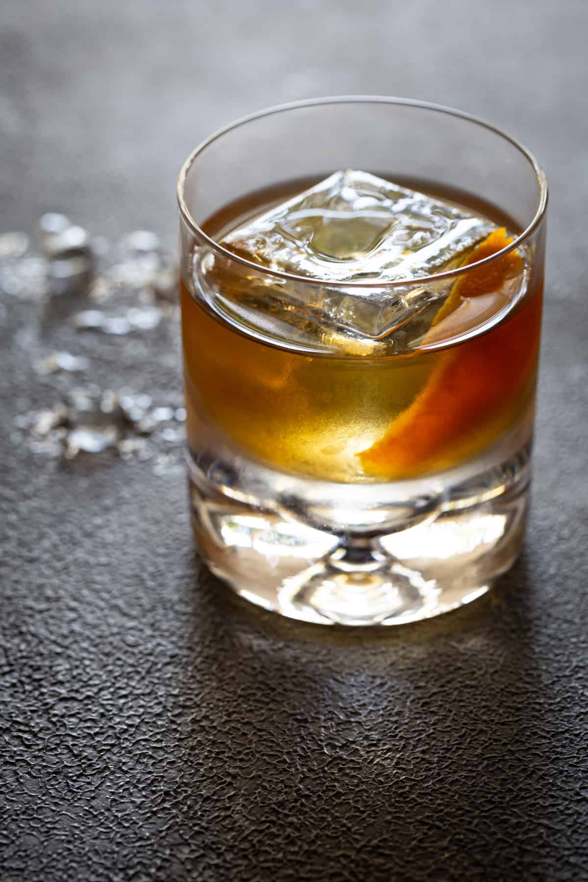 A glass with Old fashioned and Whiskey cocktail.