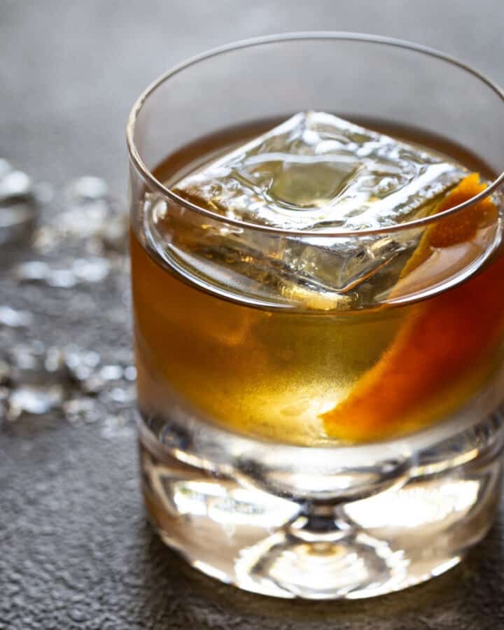 A glass of old fashioned drink.
