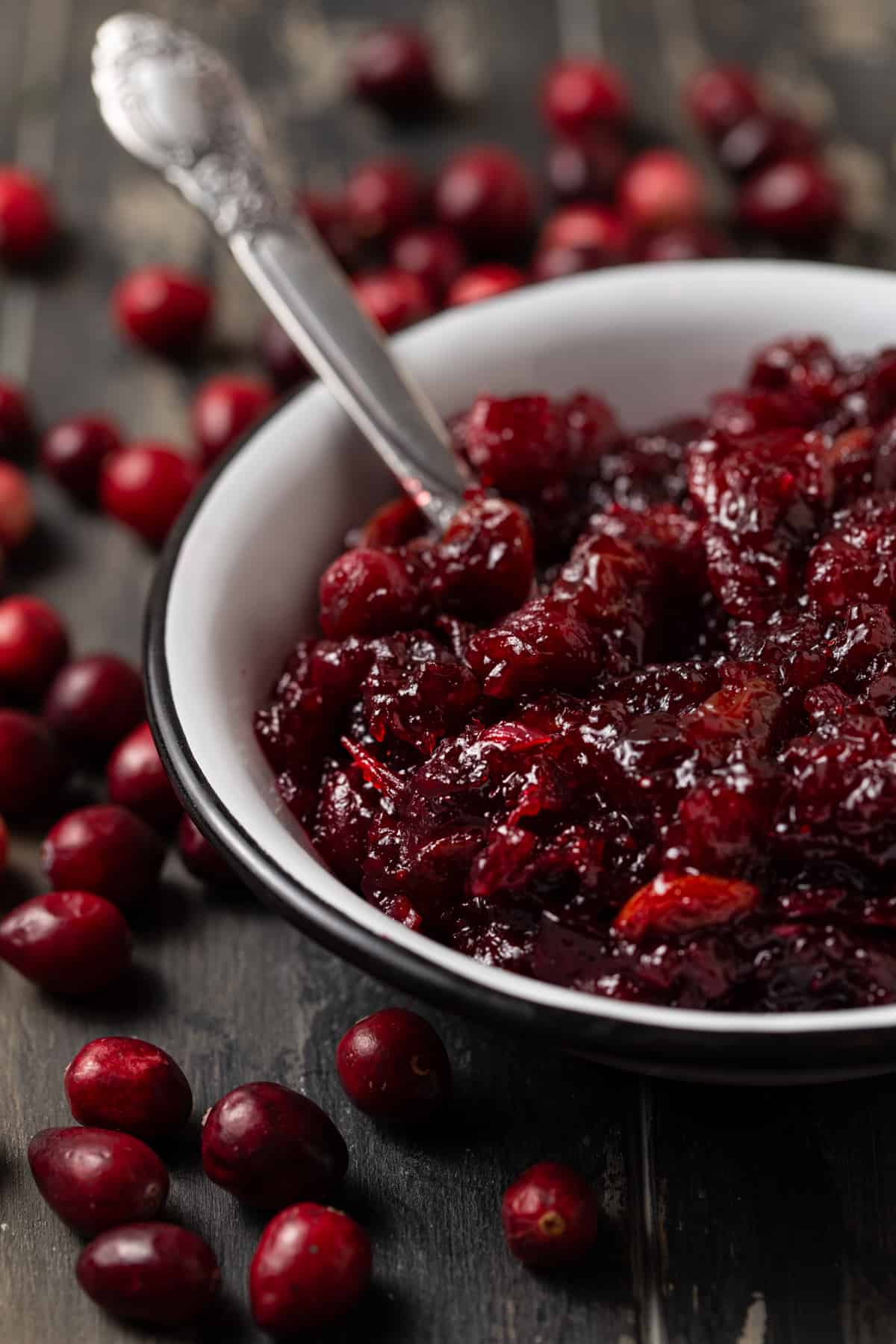 A close up of a bowl of cranberry relish, with Cranberry.