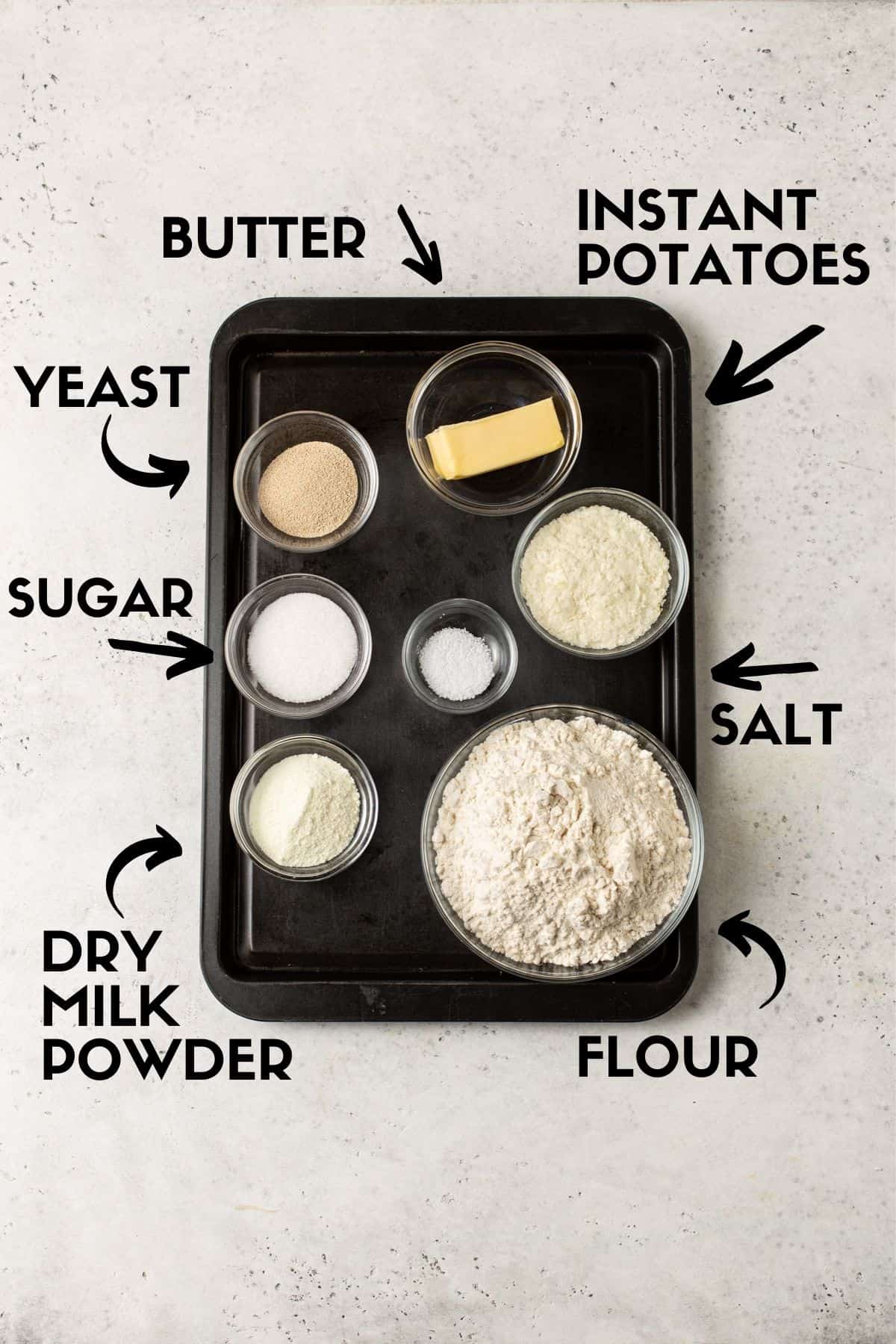 Potato roll ingredients including flour, butter, yeast, salt, sugar, dry milk powder & instant potatoes. 