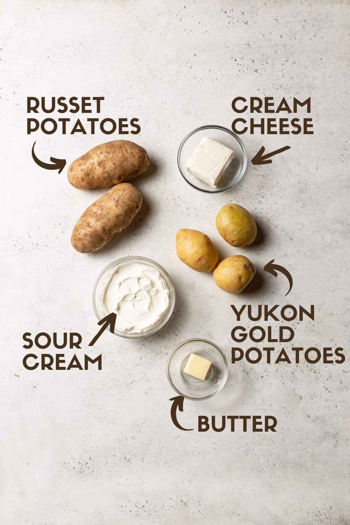 potatoes, sour cream, butter, cream cheese on white board