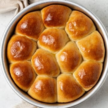 A pan of potato rolls on a table.