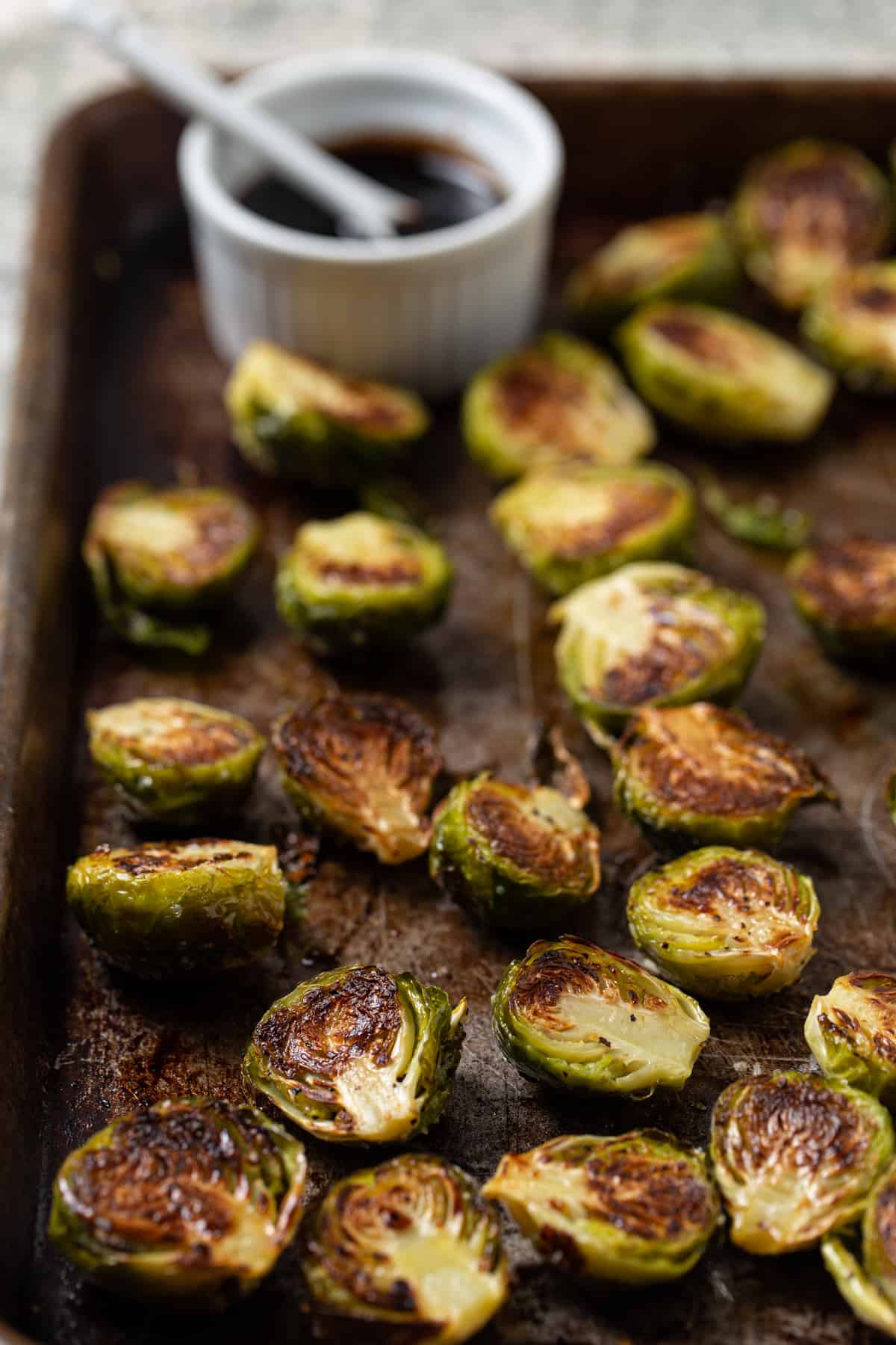 A close up of food, with Brussels sprout.