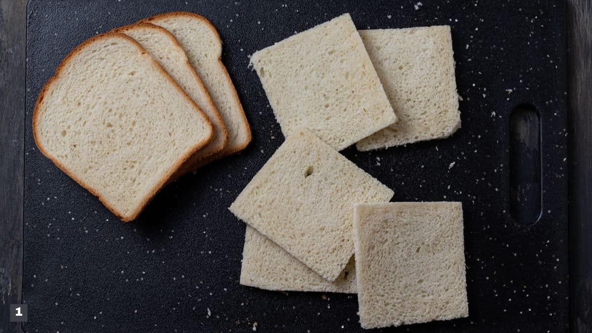 Slices of bread on cutting board.