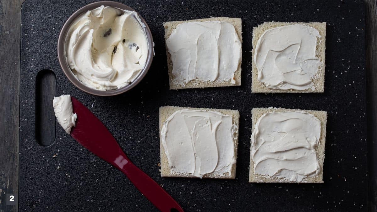 Slices of bread with cream cheese.