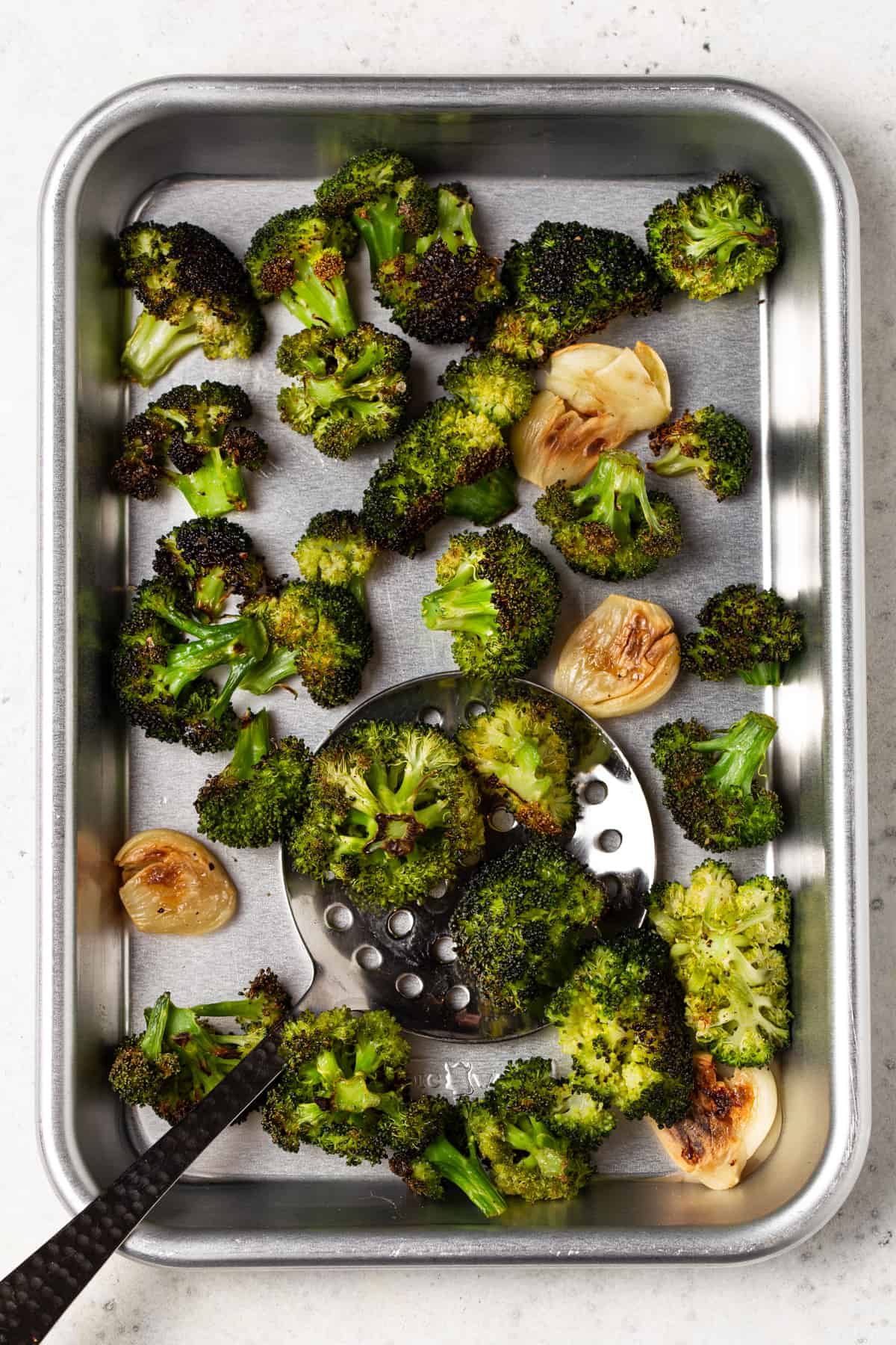 Roasted broccoli on a sheet pan. 