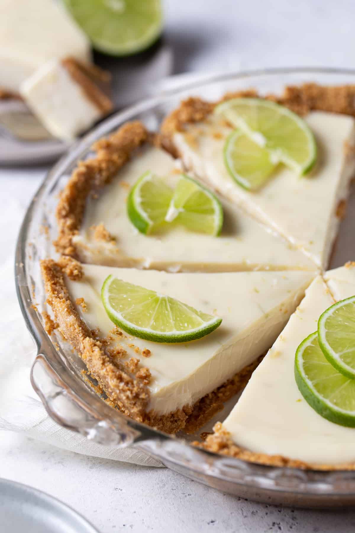 slices of pie in baking dish with lemon wheels.