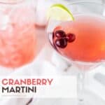 Pink drink in martini glasses with floating cranberries.