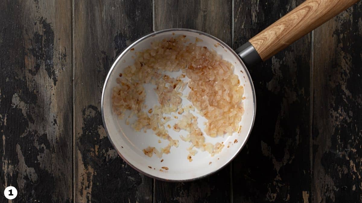 Shallots sauteed in a pot. 