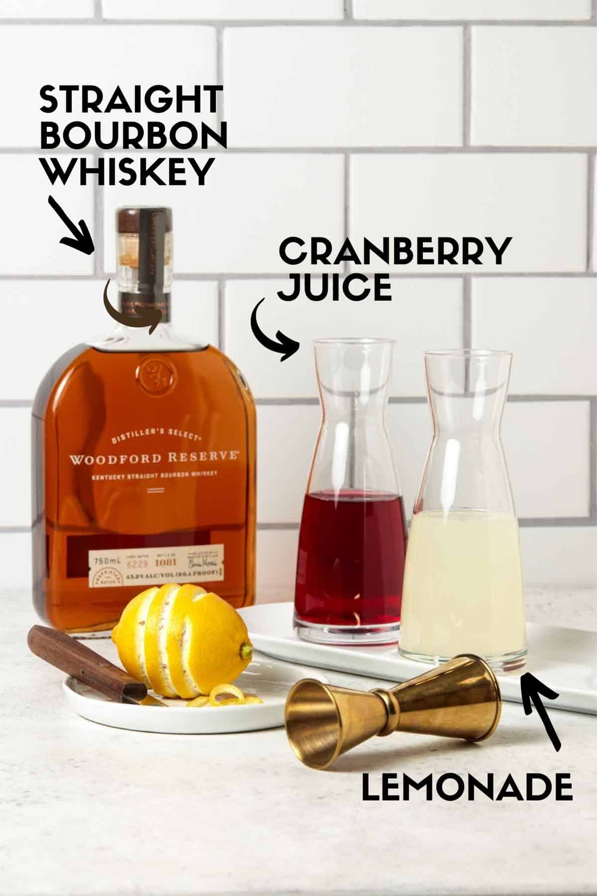 Ingredients for Woodford Spire Cocktail, including bourbon, lemonade & cranberry juice. 