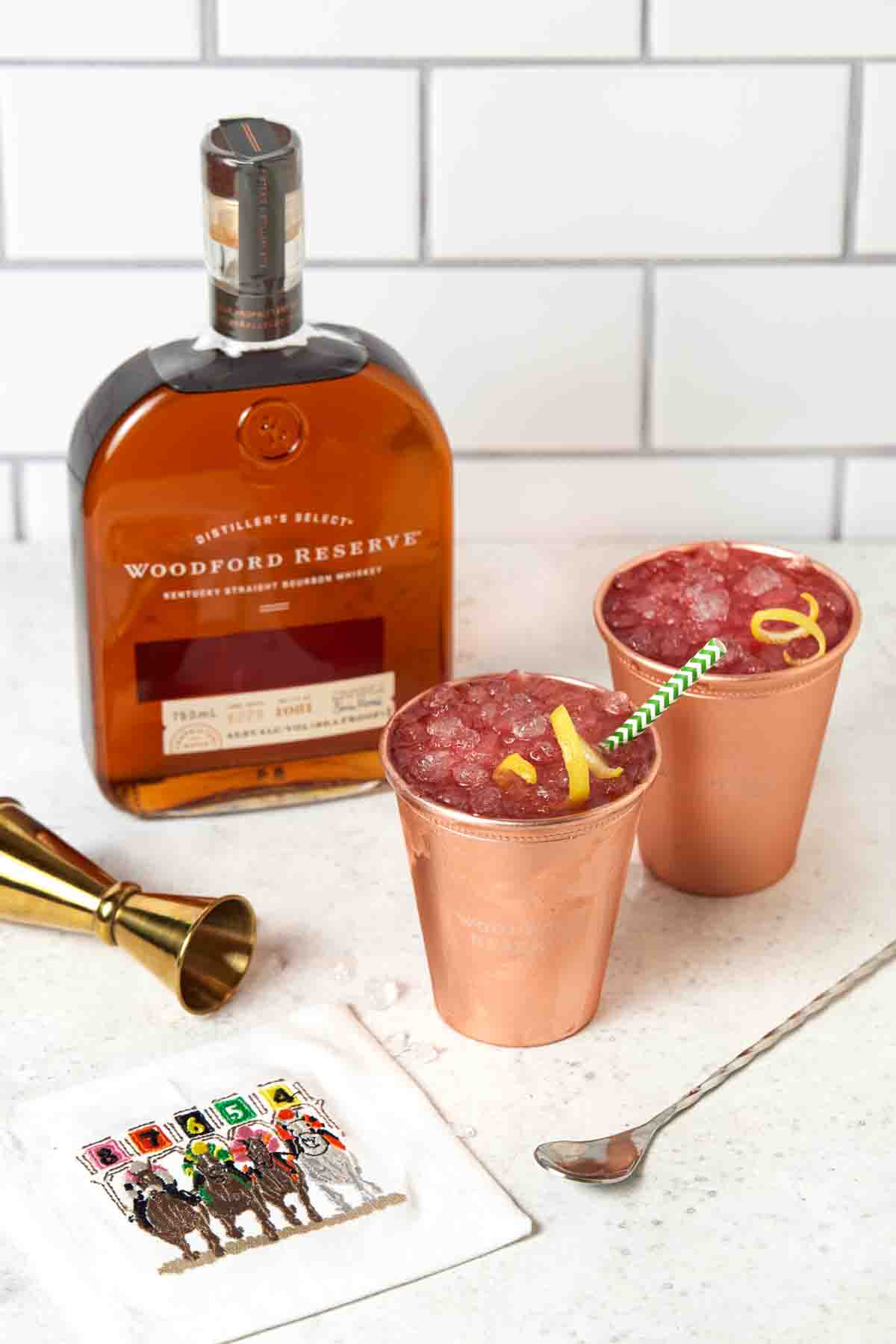 Two copper cups filled with Woodford Spire Cocktails. 